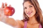 Portrait Of Happy Girl Showing Red Apple Stock Photo