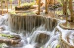 The Water Flowing Over Rocks And Trees Down A Waterfall At Huay Mae Khamin Waterfall National Park ,kanchana Buri In Thailand Stock Photo