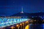 View Of Downtown Cityscape At Dongjak Bridge And Seoul Tower Over Han River In Seoul, South Korea Stock Photo