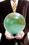 Businessman Holding Globe Stock Photo