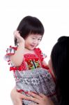 Asian Mother Playing Her Adorable Little Daughter, On White. Stu Stock Photo