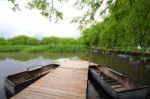 A Bridge And Boats  On The Lake Stock Photo