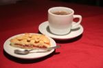 Cup Of Tea With Cake Served On The Table Stock Photo