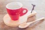 Red Mug With Wooden Plate Stock Photo