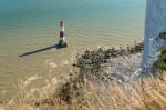 Beachey Head, Sussex/uk - July 23 : View Of The Lighthouse At Be Stock Photo