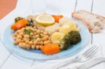 Codfish With Chickpeas And Vegetables Stock Photo