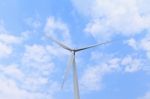 Wind Turbine With Blue Sky Closeup Stock Photo