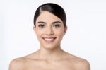 Smiling Woman With Bare Shoulders Stock Photo