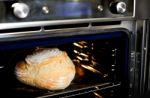 baking dough in oven Stock Photo