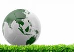 World Soccer Ball On Green Grass Stock Photo