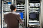 People Fix Server Network In Data Room Stock Photo