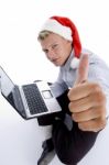 Man With Christmashat And Laptop Stock Photo