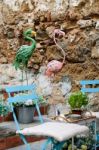 Marbella, Andalucia/spain - July 6 : Green And Pink Flamingos In Stock Photo