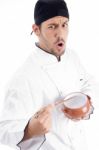 Young Male Chef Holding Bowl Stock Photo