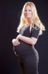 Pregnant Woman Holding Tummy Stock Photo