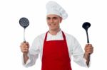 Male Chef Holding Kitchen Essentials Stock Photo