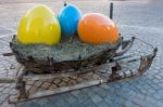 Sleigh With Three Painted Eggs In Ortisei Stock Photo