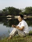 Woman Listening To Mp3 Stock Photo