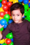 Boy Playing In Ball Land Stock Photo