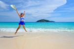 Girl Jumping With Happy On The Beach At Thailand Stock Photo