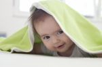 Baby Under Blanket Stock Photo