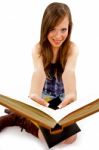 Smiling Young Woman Showing Books Stock Photo