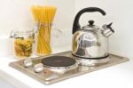 Modern Kitchen. Steel Pot And Pan On The Induction Cooker Stock Photo