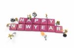 Miniature Worker Team Building Word Happy New Year On White Back Stock Photo