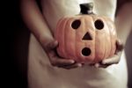 A Child Holds A Pumpkin Stock Photo