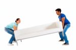 Couple Moving Sofa Stock Photo