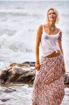 Beautiful Young Blonde Woman Posing Outdoor At The Rocky Sea Sho Stock Photo