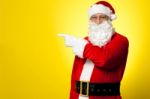 Santa Pointing Away Towards Something Stock Photo