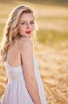 Portrait Of Beautiful Girl In Field Stock Photo