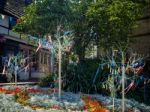 Colourful Looms And Ribbons On Artificial Trees In East Grinstea Stock Photo