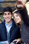 Young Tourist Couple Use Their Map And Pointing Where They Want Stock Photo