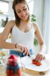 Beautiful Young Woman Preparing Breakfast At Home Stock Photo