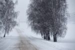 Snowfall And Sleet On Winter Road. Ice Snowy Road. Winter Snowst Stock Photo
