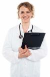 Female Doctor Holding Clipboard Stock Photo