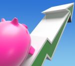 Climbing Piggy Shows Growing Investment Or Savings Stock Photo