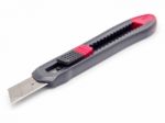 Black And Red Plastic Cutter Knife Isolated Stock Photo