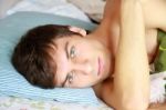 Young Man Awake Stock Photo