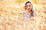 Portrait Of Beautiful Girl In Field Stock Photo