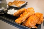 Korean Fried Chicken On Black Plate Stock Photo