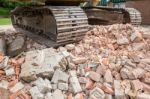 Caterpillars On Heap Of Broken Bricks Stock Photo