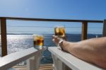 Seaside Deck Cocktails Man Arm Stock Photo