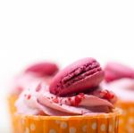 Pink Berry Cream Cupcake With Macaroon On Top Stock Photo