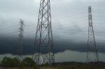 High Voltage Power Lines During A Storm Stock Photo