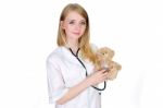 Pediatrician Examining Teddy Bear Stock Photo