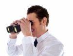 Male Looking Through Binocular Stock Photo