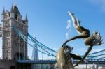 David Wayne Sculpture "girl With The Dolphin" Next To Tower Brid Stock Photo